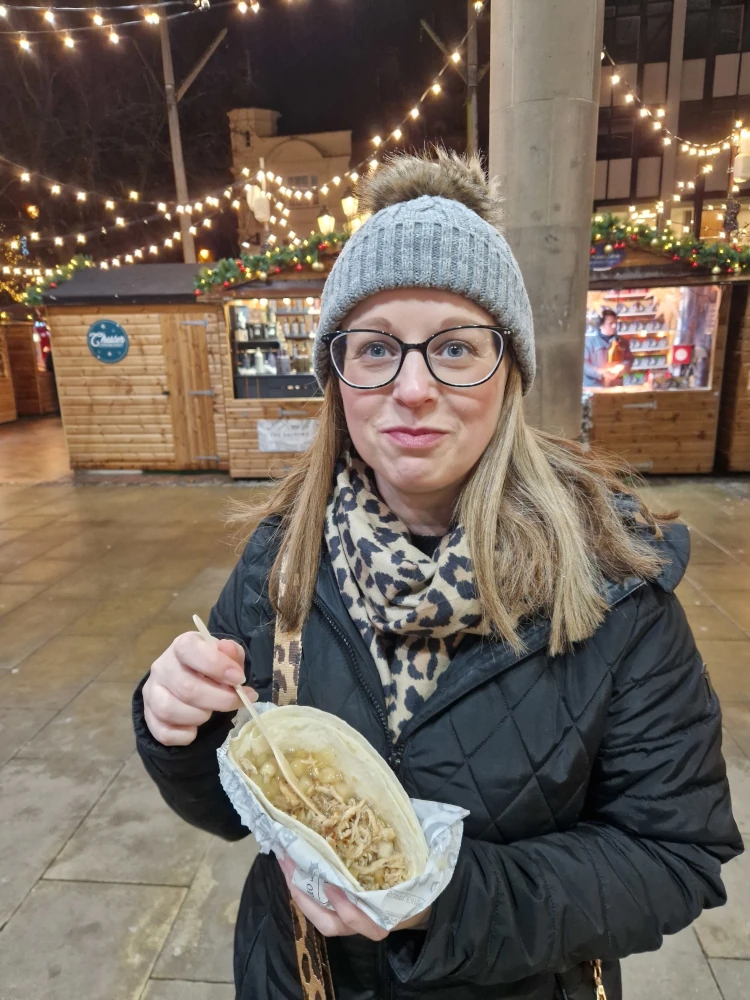 Chester Christmas Market Jo Enjoying a Pulled Pork Wrap